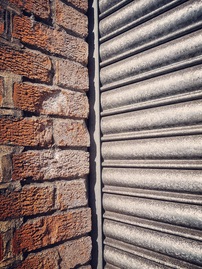 Red bricks and metal corrugated sheet metal