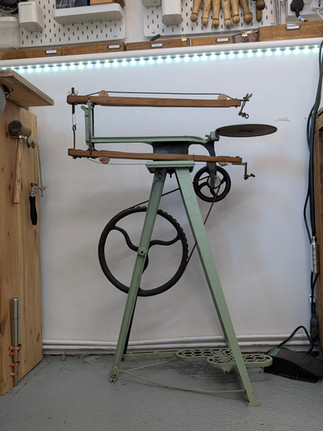 A vintage treadle saw