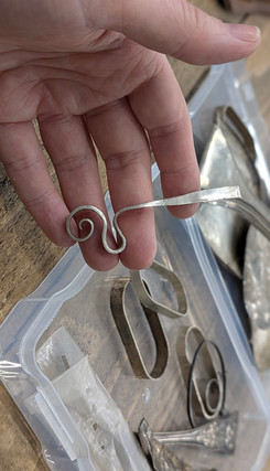 silver hand forged scroll pendant at angle