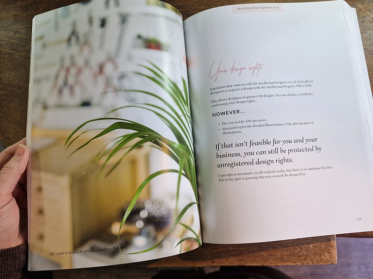 Book open on page with a plant on it